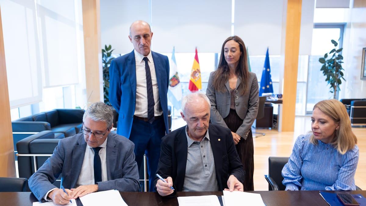 Reunión de trabajo entre representantes de la Diputación de Málaga y Fundación Metrópoli en oficina de alto nivel, con banderas de España y UE visibles